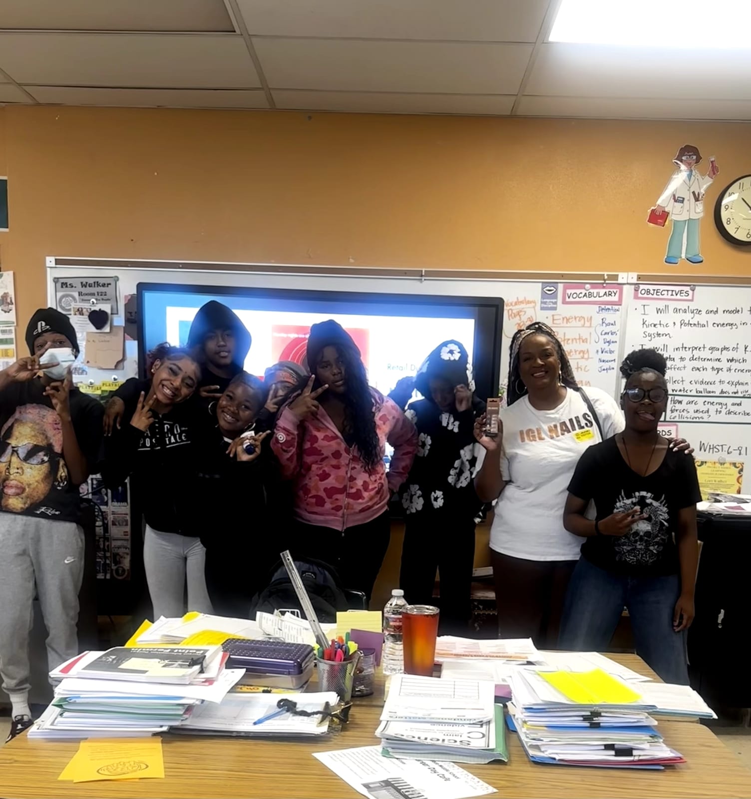Students and their instructor posing together after a nail art workshop